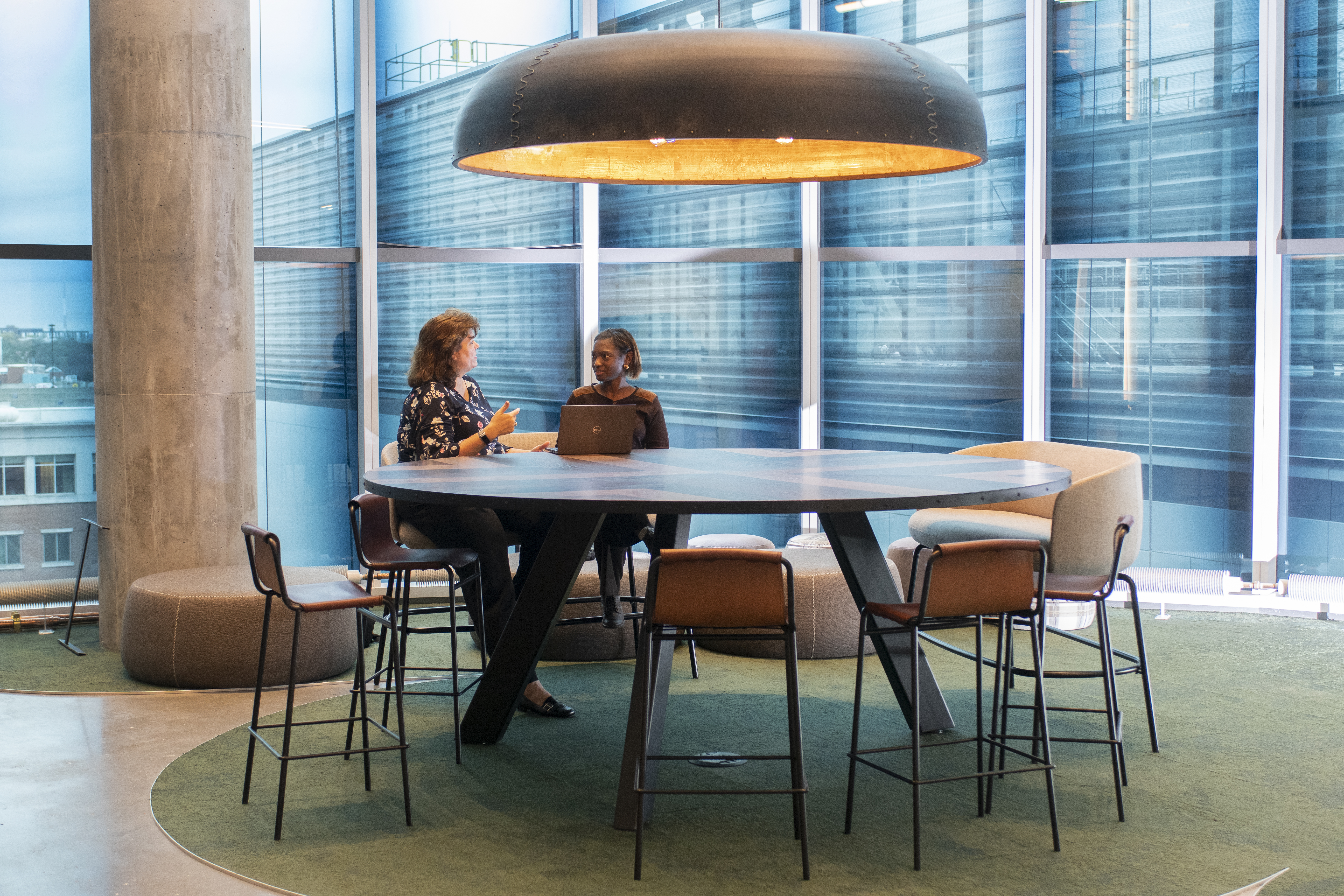 two people sitting at a computer
